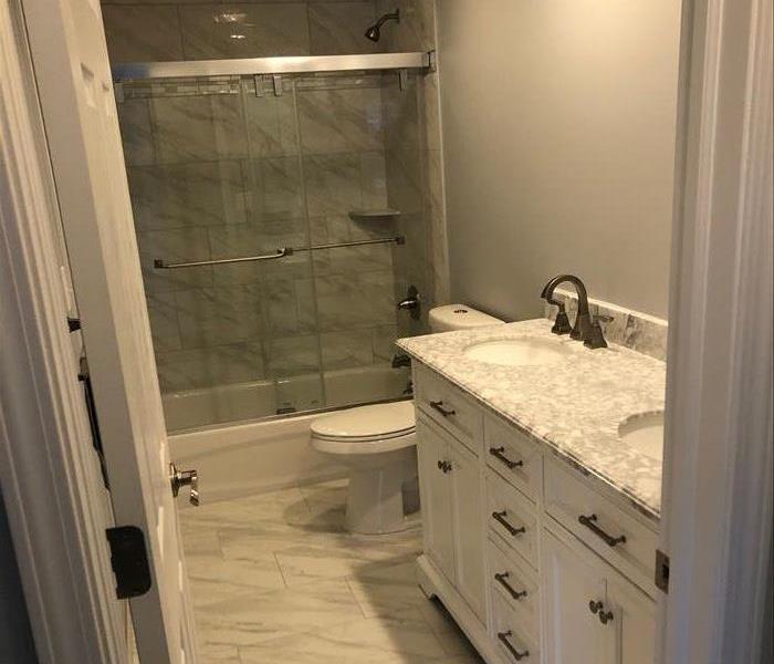 "Like it never even happened." - Cleaned and restored bathroom