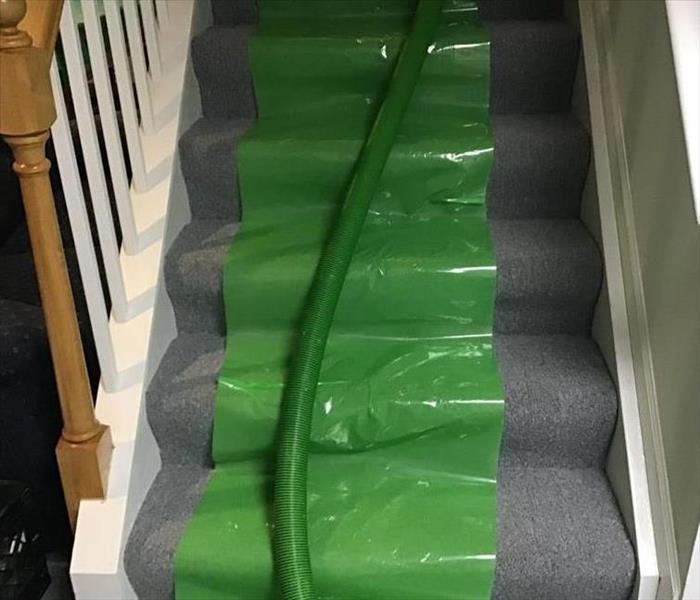 An example of floor protection used on carpet and stairs